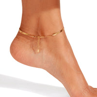 Thumbnail for Layla gold anklet profile view on bare ankle — flat snake chain with adjustable paperclip extension visible