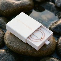 Thumbnail for Engraved Letter Anklet rose gold in Brother & Sisters gift box on beach