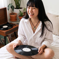 Thumbnail for Woman with a vinyl record, wearing the black secret heart photo necklace | SKU: TPH-CHTN-BLACK-SMALL