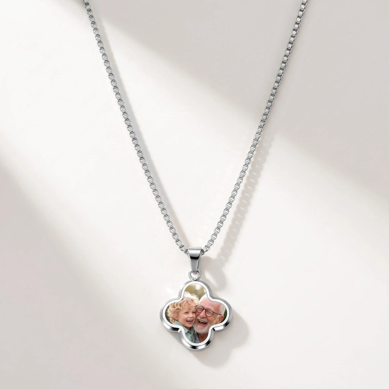 Secret Clover Photo Necklace in silver, four-leaf clover pendant on a box chain showing the hidden photo | SKU: TPH-CLVN-SILVER