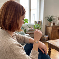 Thumbnail for Woman looking at her father's photo in the gold octagon photo bracelet | SKU: TPH-OCTB-GOLD-18
