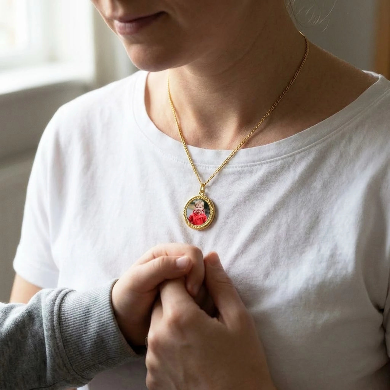 Mother and son holding hands, the gold round photo necklace with his childhood photo | SKU: TPH-RNDN-GOLD