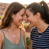 Thumbnail for Minimalist Name Necklace in silver worn by two women laughing together, the name Rosa and Nadia | SKU: minimalistnn-silver