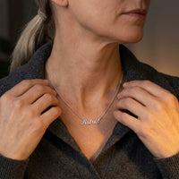 Thumbnail for Minimalist Name Necklace in silver held at the neckline with both hands, the name Astrid | SKU: minimalistnn-silver